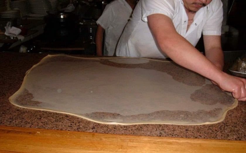 Roti canai being made