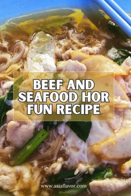 Beef And 2 Seafood Hor Fun (Best Singaporean Flat Rice Noodles In Gravy) 14 a bowl of soup with meat and vegetables